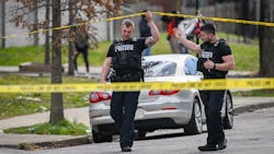 Baltimore police officers investigate a shooting scene near McCulloh and Wilson streets on Friday, March 18. Baltimore police officers investigate a shooting scene near McCulloh and Wilson streets on Friday, March 18.