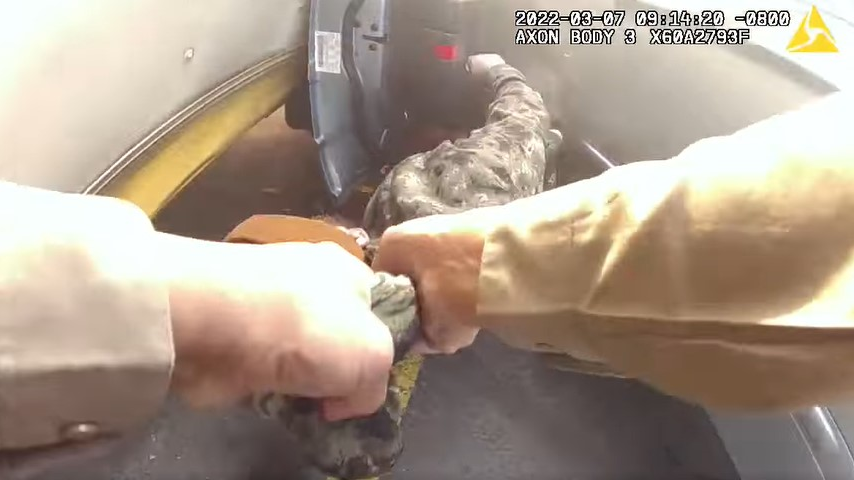 Body camera footage captured a Benton County, WA, sheriff's deputy pull an unconscious man from his burning SUV on Monday.