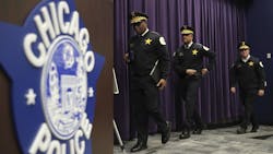 Chicago Police Superintendent David Brown (from left), First Deputy Superintendent Eric Carter and Chief of Operations Brian McDermott arrive at a news conference at police headquarters March 22. Chicago Police Superintendent David Brown (from left), First Deputy Superintendent Eric Carter and Chief of Operations Brian McDermott arrive at a news conference at police headquarters March 22.