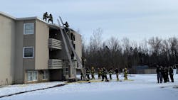A New York State Police trooper and Onondaga County sheriff’s deputies broke down an apartment building door in Clay to alert residents of a fire Monday. A New York State Police trooper and Onondaga County sheriff’s deputies broke down an apartment building door in Clay to alert residents of a fire Monday.