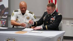 Cobb County, GA, Sheriff Craig Owens (left) and Lt. Col. David Hensel, commander of the U.S. Army Atlanta Recruiting Battalion, signed a new partnership to help the agency recruit former soldiers. Cobb County, GA, Sheriff Craig Owens (left) and Lt. Col. David Hensel, commander of the U.S. Army Atlanta Recruiting Battalion, signed a new partnership to help the agency recruit former soldiers.
