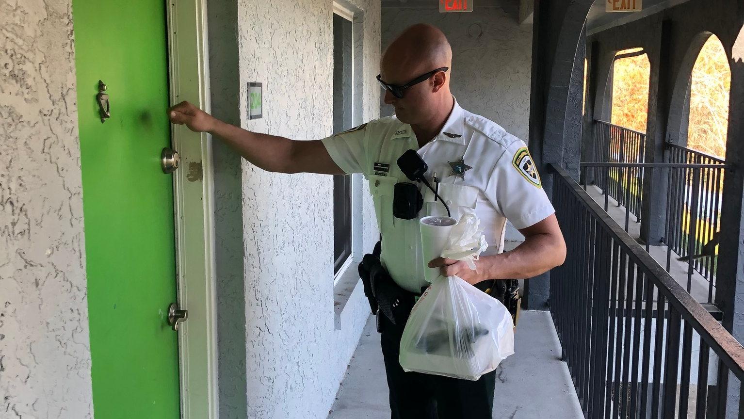 A Hillsborough County, FL, sheriff's deputy completes a Tampa area woman's food delivery order after arresting a DoorDash driver for outstanding warrants.