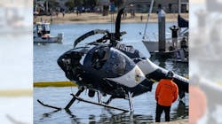 A crane lifts a Huntington Beach, CA, police helicopter out of the water in Newport Beach on Feb. 20. Officer Nicholas Vella, a 14-year veteran of the force, died in the crash the night before. A crane lifts a Huntington Beach, CA, police helicopter out of the water in Newport Beach on Feb. 20. Officer Nicholas Vella, a 14-year veteran of the force, died in the crash the night before.