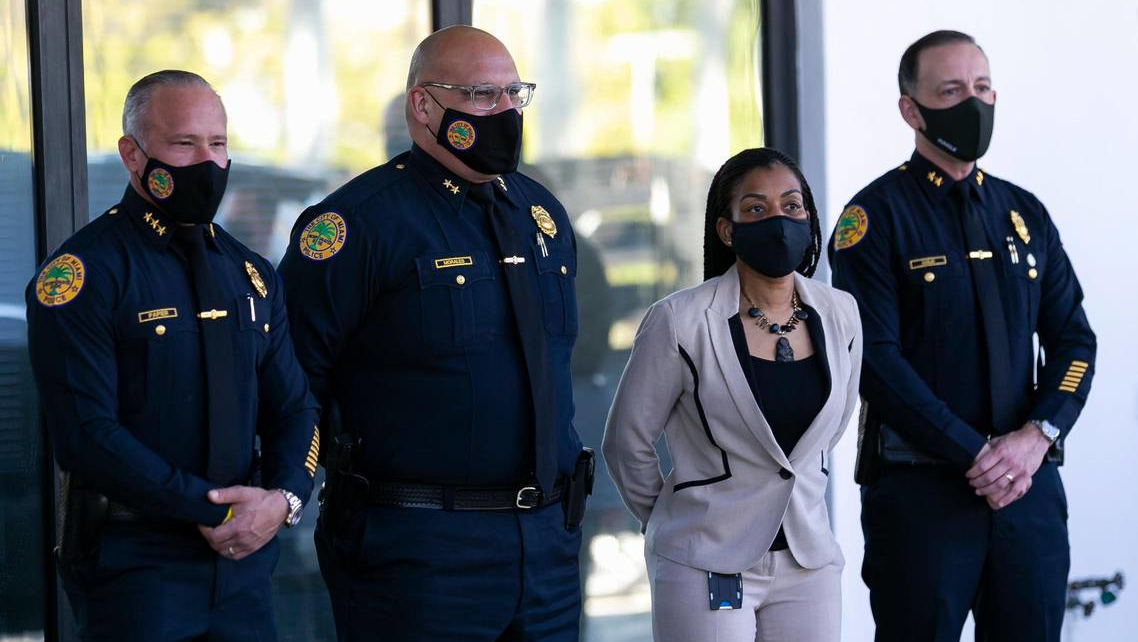 Manny Morales (second from left) was named the new permanent chief of the Miami Police Department on Monday.