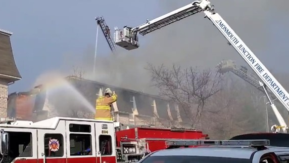 South Brunswick, NJ, police and firefighters caught a young boy who was tossed by his father from a second-floor balcony early Monday to escape an apartment complex fire.