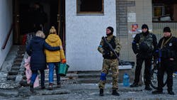 Residents remove debris from a damaged residential building Thursday in Kyiv, Ukraine. Residents remove debris from a damaged residential building Thursday in Kyiv, Ukraine.