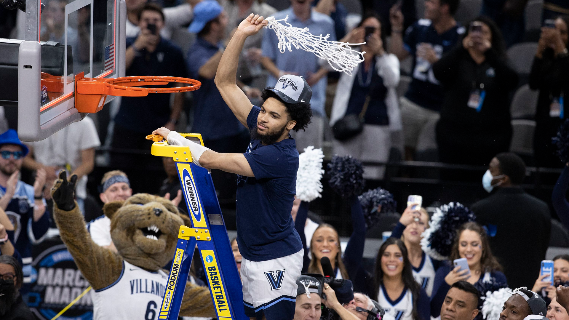 Caleb Daniels makes the final cut on the net as Villanova celebrates winning the South Regional championship game in the NCAA Tournament on Saturday at AT&T Arena in San Antonio, Texas. They advance to the Final Four in New Orleans.