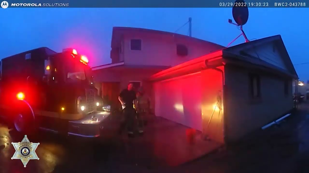 Watch Colo. Deputies Save Several Dogs from RV Fire | Officer