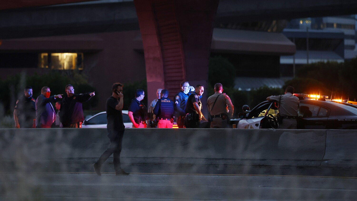 Authorities investigate a shooting involving a California Highway Patrol officer along Interstate 8 near Interstate 805 in Mission Valley on Wednesday.