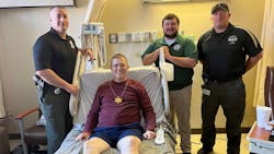 Chapin, IL, Police Chief Steven Helmich (center) needed three emergency surgeries after he was shot twice by a suspect last month. Chapin, IL, Police Chief Steven Helmich (center) needed three emergency surgeries after he was shot twice by a suspect last month.