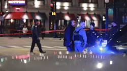 Chicago police work the scene at Grand and State in Chicago's Near North neighborhood after an accident involving a police officer on April 9, 2022.