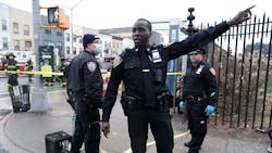 Police and emergency responders gather at the site of a shooting of at least five passengers aboard a New York City subway train Monday. Police and emergency responders gather at the site of a shooting of at least five passengers aboard a New York City subway train Monday.