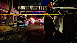 Sacramento, CA, Police Officer David Bell stands watch at the scene of a mass shooting that left six people dead and 12 injured Sunday.