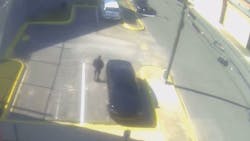 The chief deputy for the Walker County, AL, Sheriff's Office is seen in security camera footage spotting a man allegedly tying a drug-filled sock to the fence of the jail Tuesday. The chief deputy for the Walker County, AL, Sheriff's Office is seen in security camera footage spotting a man allegedly tying a drug-filled sock to the fence of the jail Tuesday.