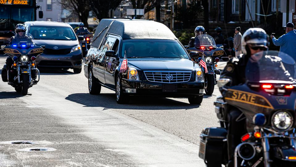 A funeral procession Friday for Lebanon, PA, Police Lt. William Lebo heads from Lebanon to the Giant Center, where a memorial service will be held.