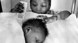 The children of Elizabeth Dunlap: Tara, age 4, looks at her sister, Tenille, 6-weeks old, at Loyola University Hospital on Jan. 4, 1977. They were recovering from exposure after they were found huddled next to their mother's body the previous week.