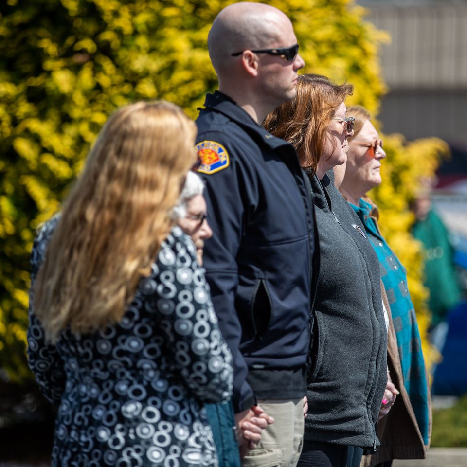 The family of slain Lebanon City Police Lt. William Lebo, watch as his casket is returned to Lebanon, PA, after an autopsy in Allentown on Saturday.