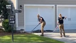 Two officers from the Charleston, SC, Police Department's Animal Control Unit wrangled an alligator that wandered close to a school Monday. Two officers from the Charleston, SC, Police Department's Animal Control Unit wrangled an alligator that wandered close to a school Monday.