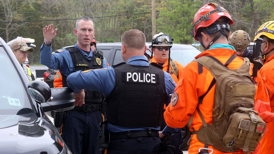 Franklin Township, NJ, Police Sgt. Joe Murray briefs team members from various agencies during the Gloucester County Child Abduction Response Team drill at Malaga Lake Park on April 26.
