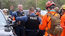 Franklin Township, NJ, Police Sgt. Joe Murray briefs team members from various agencies during the Gloucester County Child Abduction Response Team drill at Malaga Lake Park on April 26. Franklin Township, NJ, Police Sgt. Joe Murray briefs team members from various agencies during the Gloucester County Child Abduction Response Team drill at Malaga Lake Park on April 26.