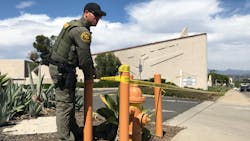 Allen J. Schaben | Los Angeles Times | TNS An Orange County, CA, sheriff's deputy ties crime scene tape in front of Geneva Presbyterian Church in Laguna Woods on Sunday following a shooting that killed one person and critically wounded four. Allen J. Schaben | Los Angeles Times | TNS An Orange County, CA, sheriff's deputy ties crime scene tape in front of Geneva Presbyterian Church in Laguna Woods on Sunday following a shooting that killed one person and critically wounded four.