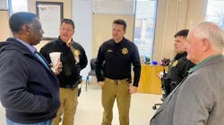 Limestone County, AL, Sheriff Joshua McLaughlin (center) and School Resource Officers Jason Pendergrass (left) and Caleb King talk with county officials during School Resource Officer Appreciation Day in February. Limestone County, AL, Sheriff Joshua McLaughlin (center) and School Resource Officers Jason Pendergrass (left) and Caleb King talk with county officials during School Resource Officer Appreciation Day in February.