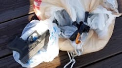 Ontario, Canada, Provincial Police discovered 11 handguns in a plastic bag after a drone carried them from the United States and into Canada before becoming caught in a tree. Ontario, Canada, Provincial Police discovered 11 handguns in a plastic bag after a drone carried them from the United States and into Canada before becoming caught in a tree.