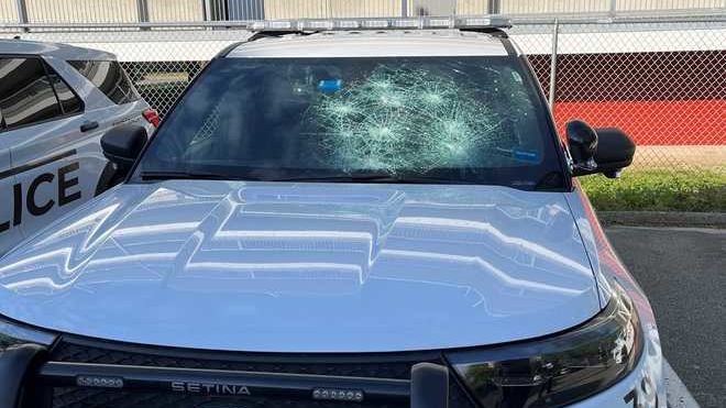 A man is accused of using a hammer to shatter the windshields of four Saco, ME, police vehicles