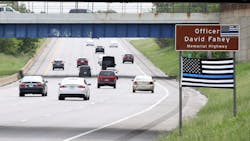 A Thin Blue Line flag hangs below the sign honoring fallen Cleveland Police Officer David Fahey, who was killed in the line of duty along this stretch of Interstate 90 in 2017. A Thin Blue Line flag hangs below the sign honoring fallen Cleveland Police Officer David Fahey, who was killed in the line of duty along this stretch of Interstate 90 in 2017.