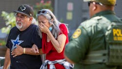 A woman cries Tuesday as she leaves the Uvalde, TX, Civic Center. At least 14 students and a teacher were killed when a gunman opened fire at Robb Elementary School. A woman cries Tuesday as she leaves the Uvalde, TX, Civic Center. At least 14 students and a teacher were killed when a gunman opened fire at Robb Elementary School.