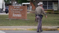 An officer walks outside of Robb Elementary School in Uvalde, TX, on Tuesday after an 18-year-old gunman killed 19 children and two adults at the school in the nation's deadliest school shooting in years. An officer walks outside of Robb Elementary School in Uvalde, TX, on Tuesday after an 18-year-old gunman killed 19 children and two adults at the school in the nation's deadliest school shooting in years.