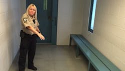 Assistant Lauderdale County, AL, Jail Director Vicky White shows a holding cell for inmates awaiting transfer in 2016.