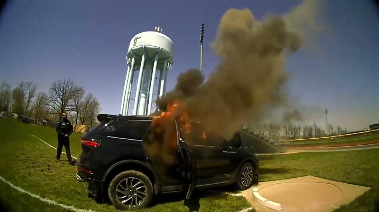 Watch N.Y. Police Officers Rescue Man from Burning SUV | Officer