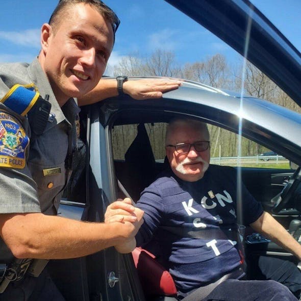 Connecticut State Police Trooper Lukasz Lipert, a native of Poland, helped former Polish President Lech Walesa fix a flat tire in Tolland on Wednesday.