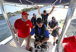 Capt. Art Serig (left) with Tactical Advantage Consultants instructs Wilton Manors, FL, Assistant Police Chief Darren Brodsky (center) in maneuvering a boat last week, along with Hollywood Police officers Alex Ramirez, Will LaPierre, and Alfred Stabile. Capt. Art Serig (left) with Tactical Advantage Consultants instructs Wilton Manors, FL, Assistant Police Chief Darren Brodsky (center) in maneuvering a boat last week, along with Hollywood Police officers Alex Ramirez, Will LaPierre, and Alfred Stabile.