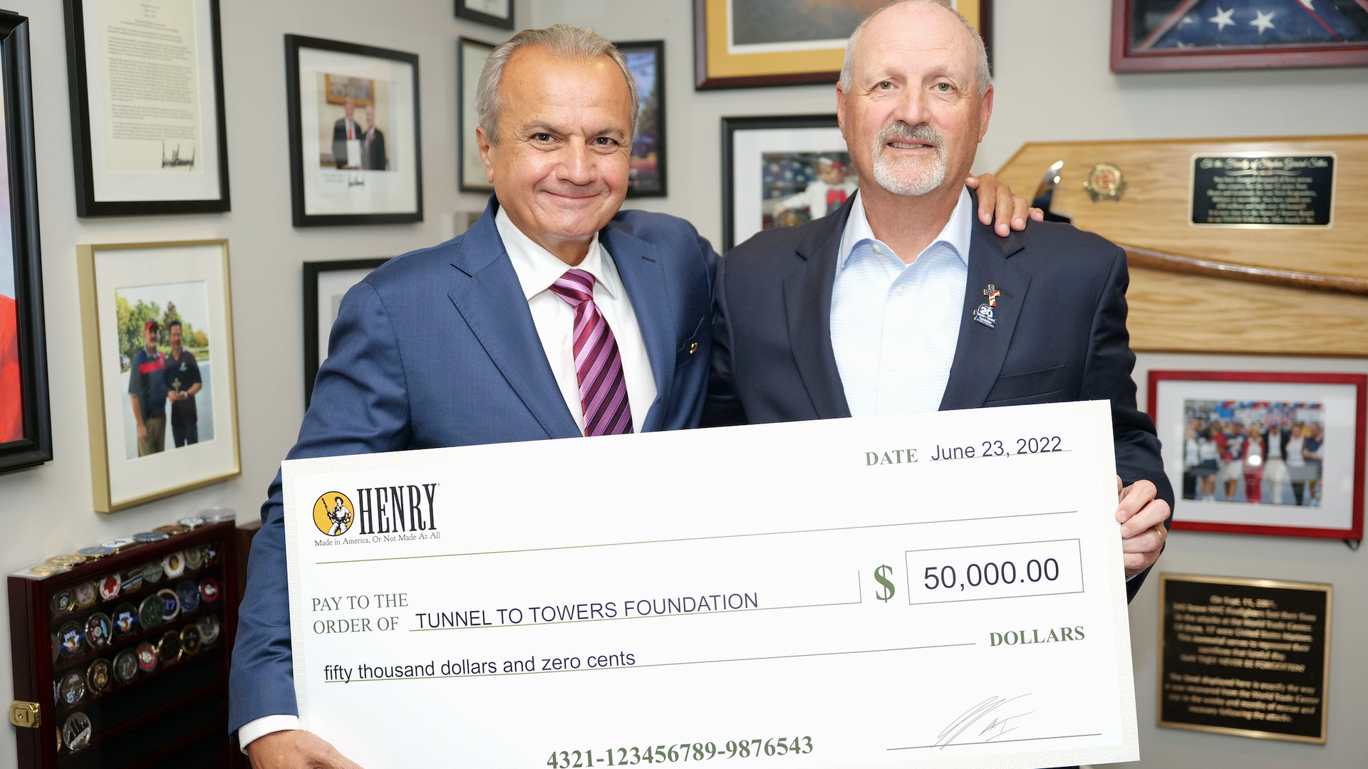 Henry CEO & Founder Anthony Imperato (left) presenting Tunnel to Towers Foundation CEO & Chairman Frank Siller (right) with the first donation of Henry Repeating Arms&rsquo; $1,000,000 pledge