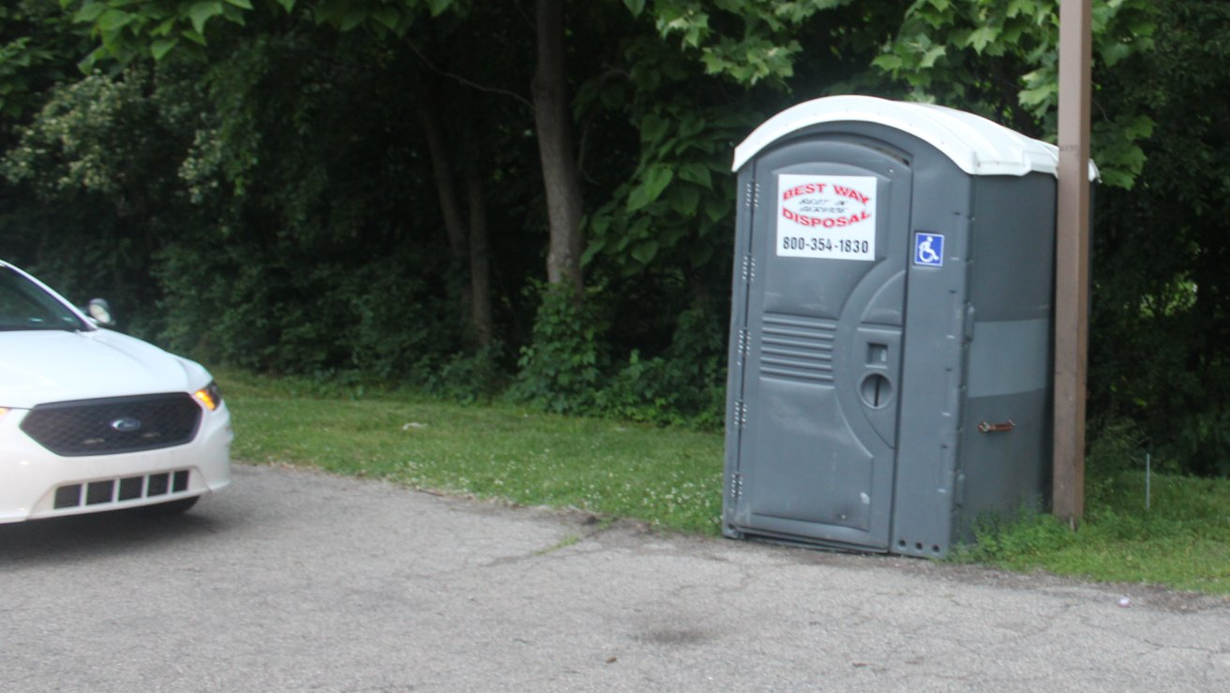 Two armed robbery suspects tried to escape Indianapolis police by hiding in a Porta-Potty and ditching two of their handguns in the toilet's waste compartment.