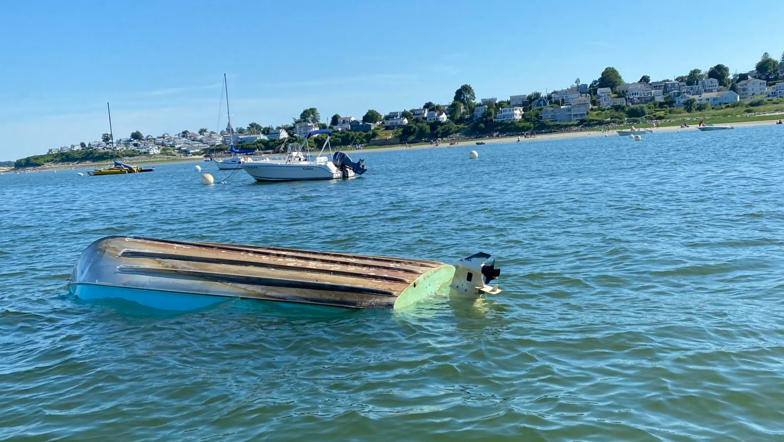 An Ipswich, MA, police officer rescued a pregnant woman, a 14-month-old girl and three others after their boat capsized off Clark Beach on Saturday.