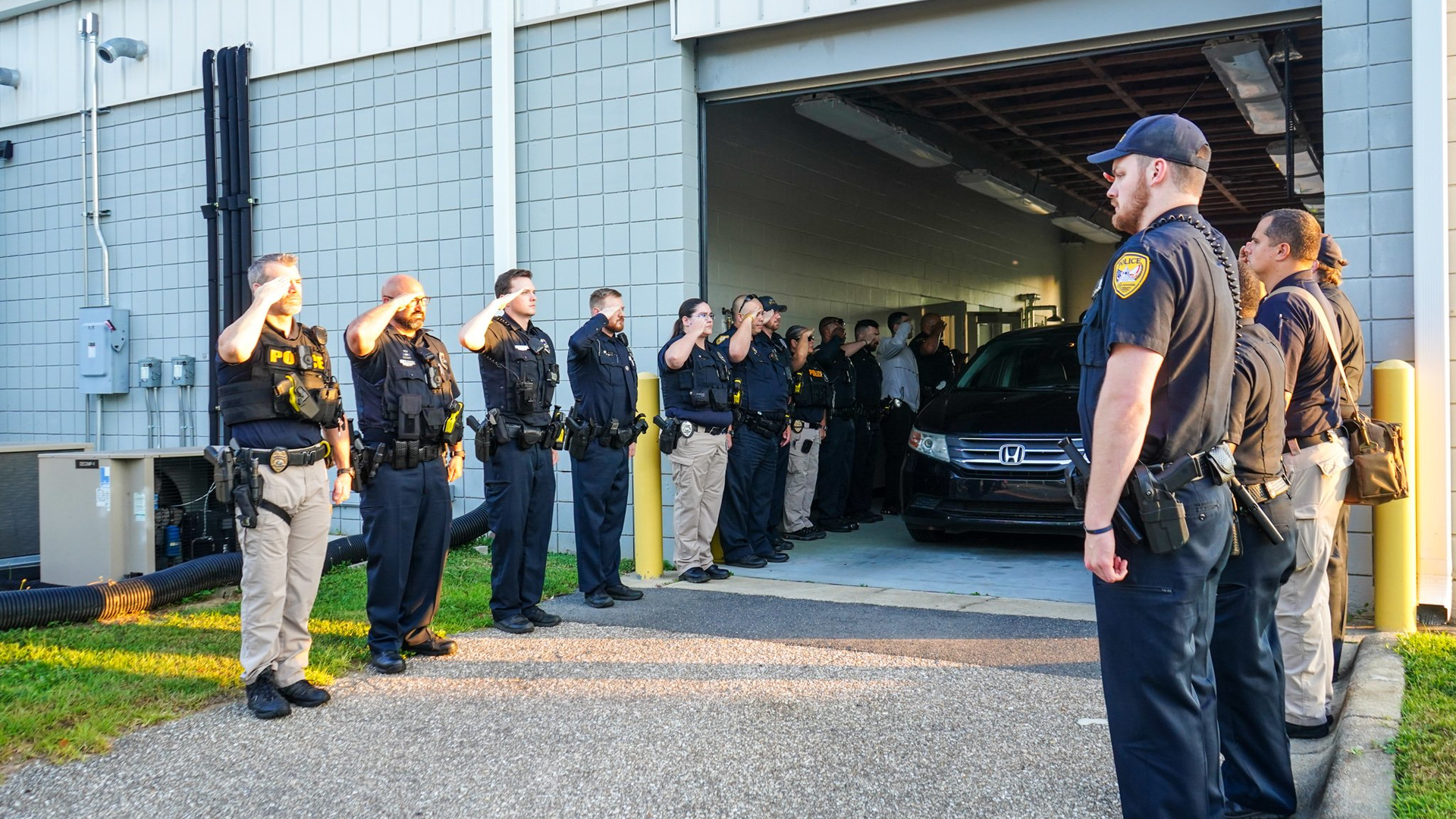 Tallahassee, FL, police officers mourn a fallen colleague who died following a collision with a fleeing suspect in a triple shooting early Wednesday.