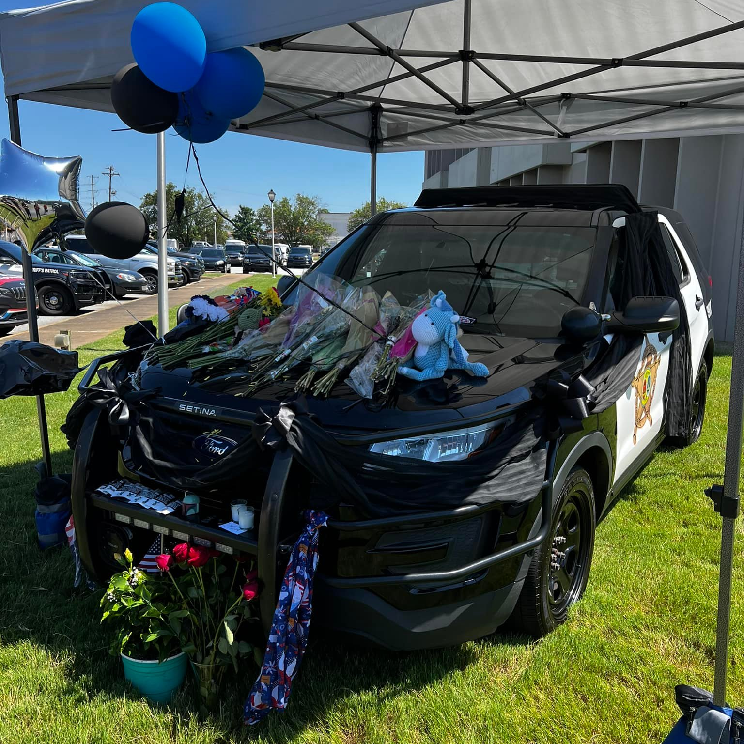 A memorial was created for slain Spartanburg County, SC, Sheriff's Deputy Austin Aldridge with his patrol car at the station.