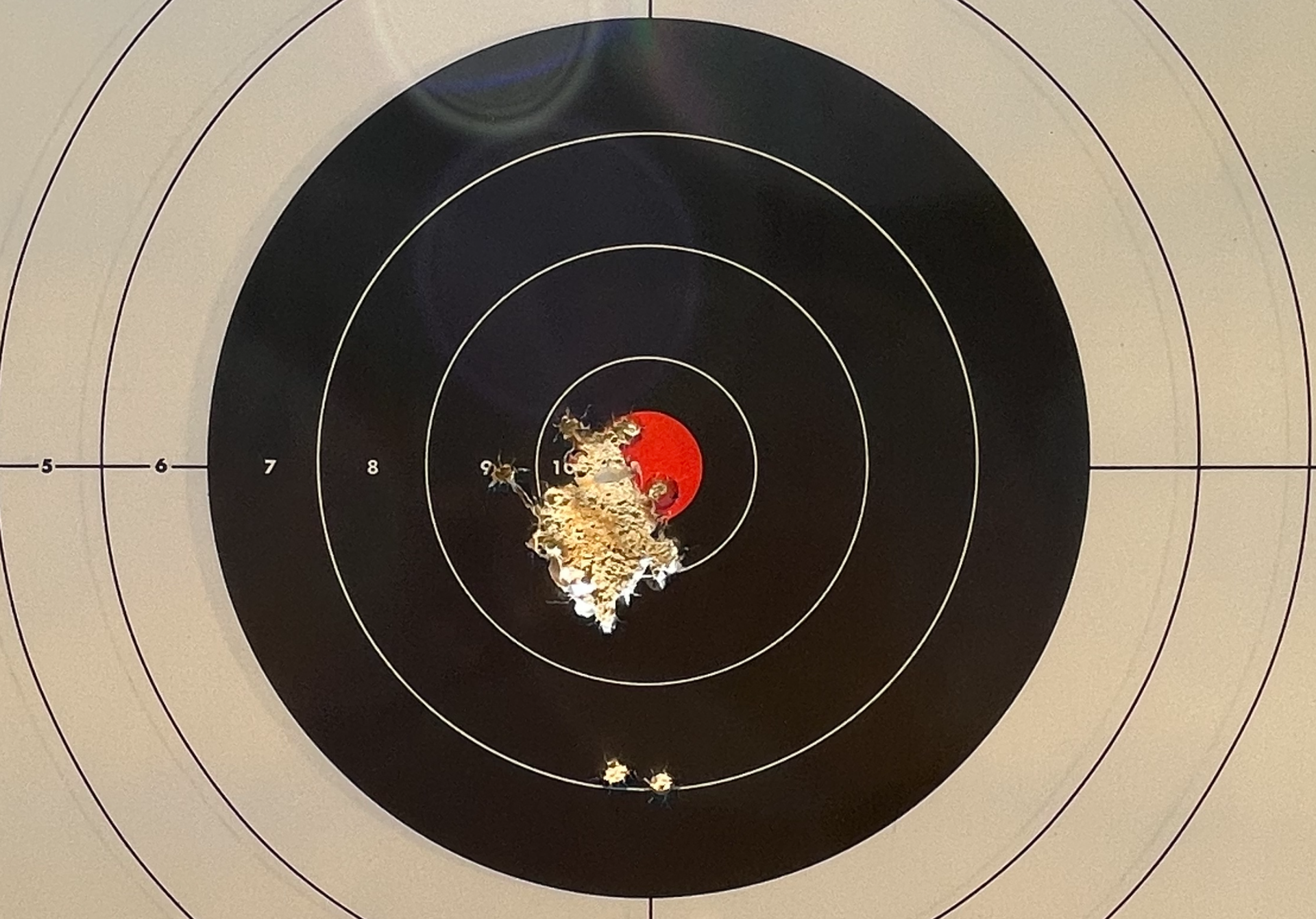 Those two low shots and the one farthest left were before zeroing the red dot sight. That other single ragged hole measures about 1.34' at the largest point and is 47 rounds fired unsupported at 15 yards.