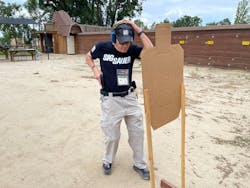 After training with his 'finger gun', Lindsey ran the drill slowly. In this photo, notice that the gun has already cleard the holster. The muzzle should be further oriented toward the target. After training with his 'finger gun', Lindsey ran the drill slowly. In this photo, notice that the gun has already cleard the holster. The muzzle should be further oriented toward the target.