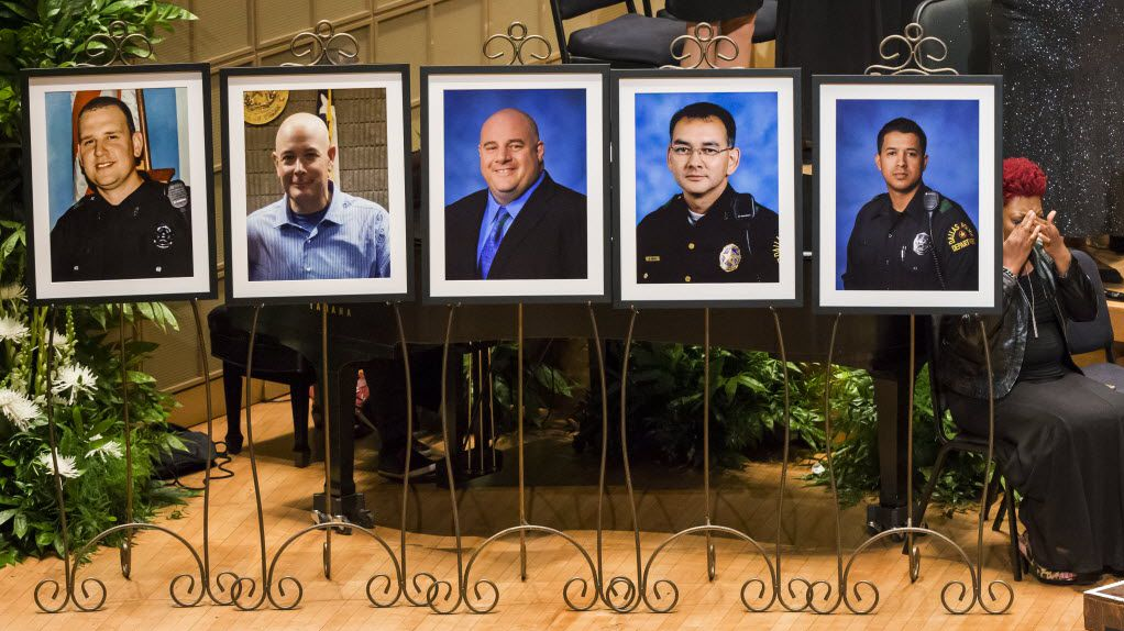 Gaye Arbuckle wipes her eyes after singing during an 2016 interfaith memorial service at the Morton H. Meyerson Symphony Center in Dallas for five law enforcement officers killed in an ambush at a Black Lives Matter rally. The victims were (from left) Dallas Police Officer Michael Krol, DART (Dallas Area Rapid Transit) Officer Brent Thompson, Dallas Police Officer Lorne Ahrens, Dallas Police Officer Michael Smith, and Dallas Police Officer Patrick Zamarripa.