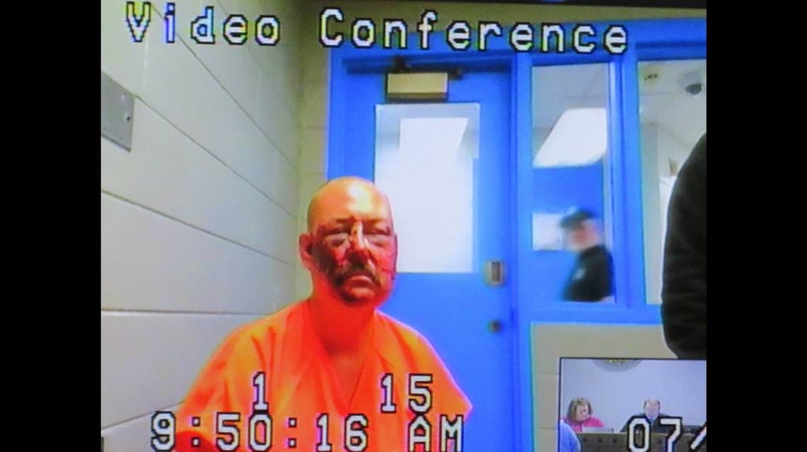 Lance Storz, accused of murdering two police officers during a stand-off in Floyd County, KY, appears by video from jail for his arraignment Friday.