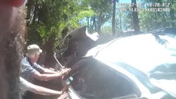 A Volusia County, FL, sheriff's deputy and two bystanders flipped over a car in a canal in Oak Hill to rescue a trapped unconscious driver Tuesday. A Volusia County, FL, sheriff's deputy and two bystanders flipped over a car in a canal in Oak Hill to rescue a trapped unconscious driver Tuesday.