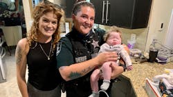 Lee County Sheriff&apos;s Deputy Deputy Michelle Wilson is seen with Wylder after she saved her after she stopped breathing.