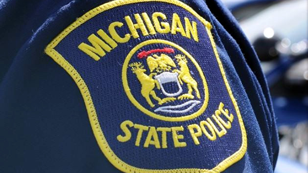 A trooper was on patrol when he was flagged down by a 'frantic' motorist, who told him her baby was not breathing.