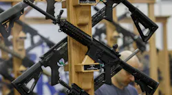 AR-15 style rifles from Rock River Arms are displayed during the National Rifle Association annual meeting in 2018 in Dallas.
