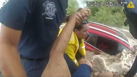 Watch Ariz. Police Officers' Dramatic Raging Water Rescue Officer