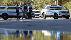 Chicago police officers investigate a shooting scene Friday.